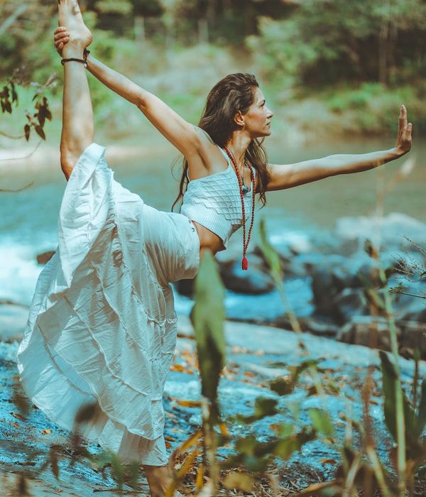 Woman in a graceful yoga pose representing harmony and balance.